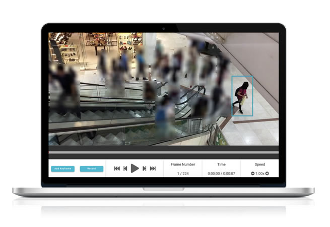 Laptop showing Pixelate automatically blurring faces in mall escalator CCTV footage, with one person's bounding box left unblurred for the requester